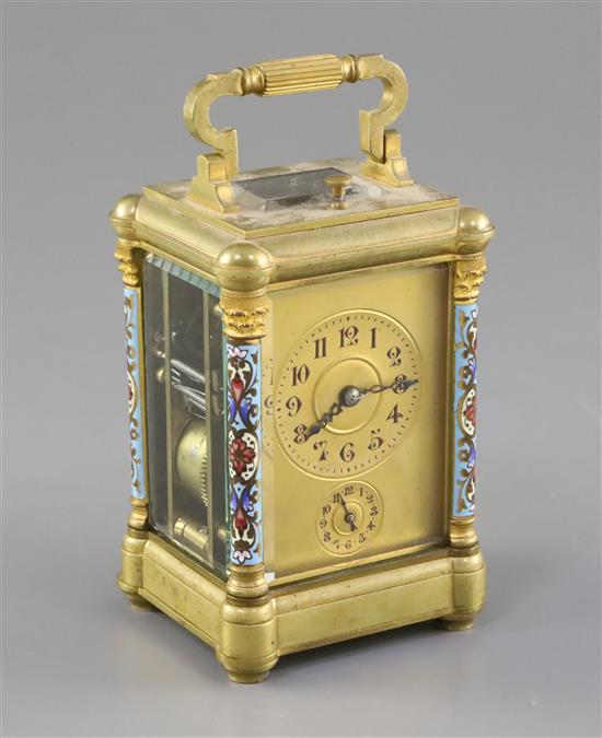 An early 20th century French ormolu and champleve enamel repeating carriage clock with alarm, 4.5in.